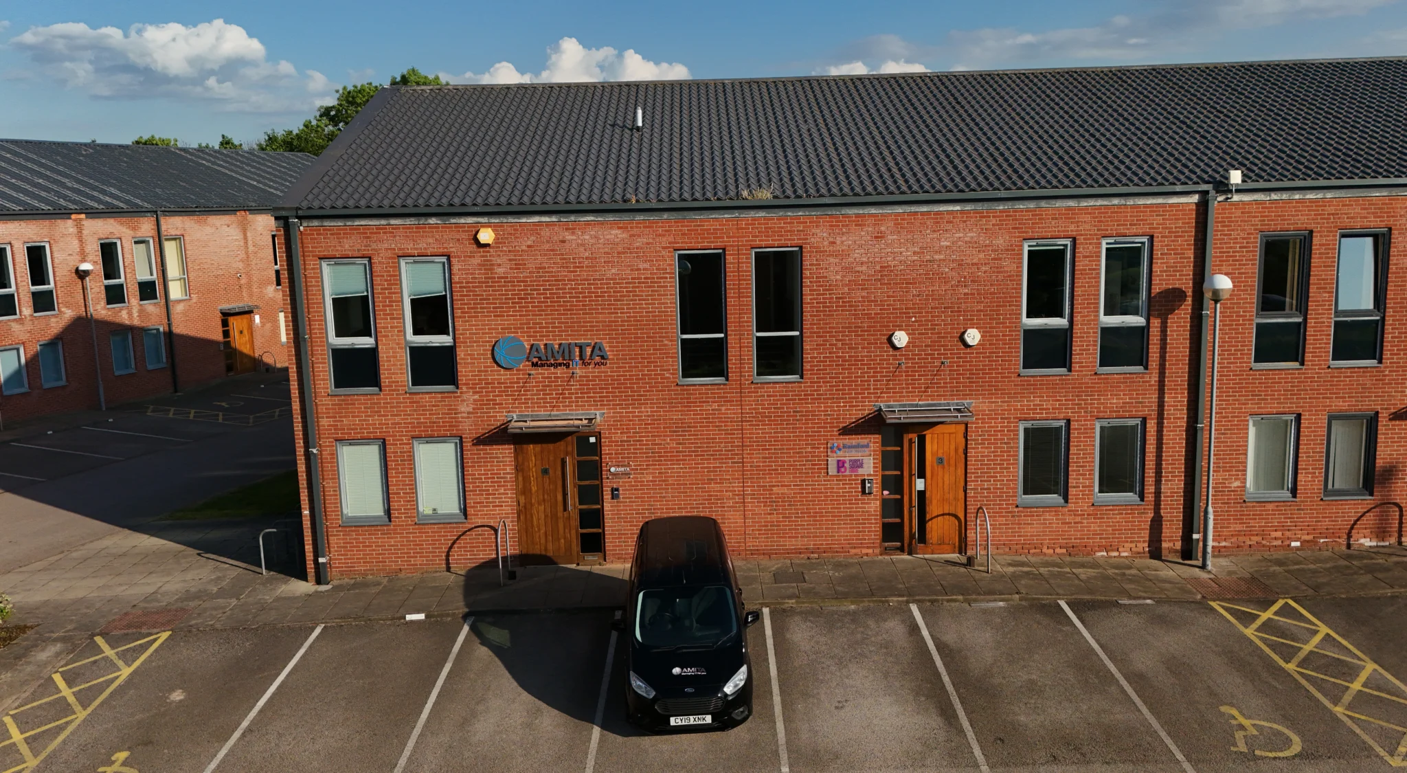 amita building with parking space